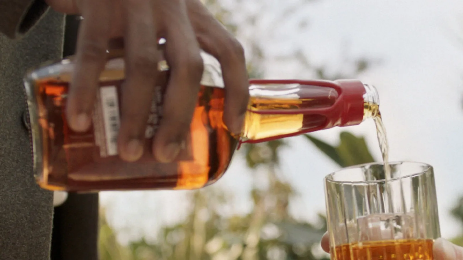 Maker’s Mark bourbon whisky pouring in glass